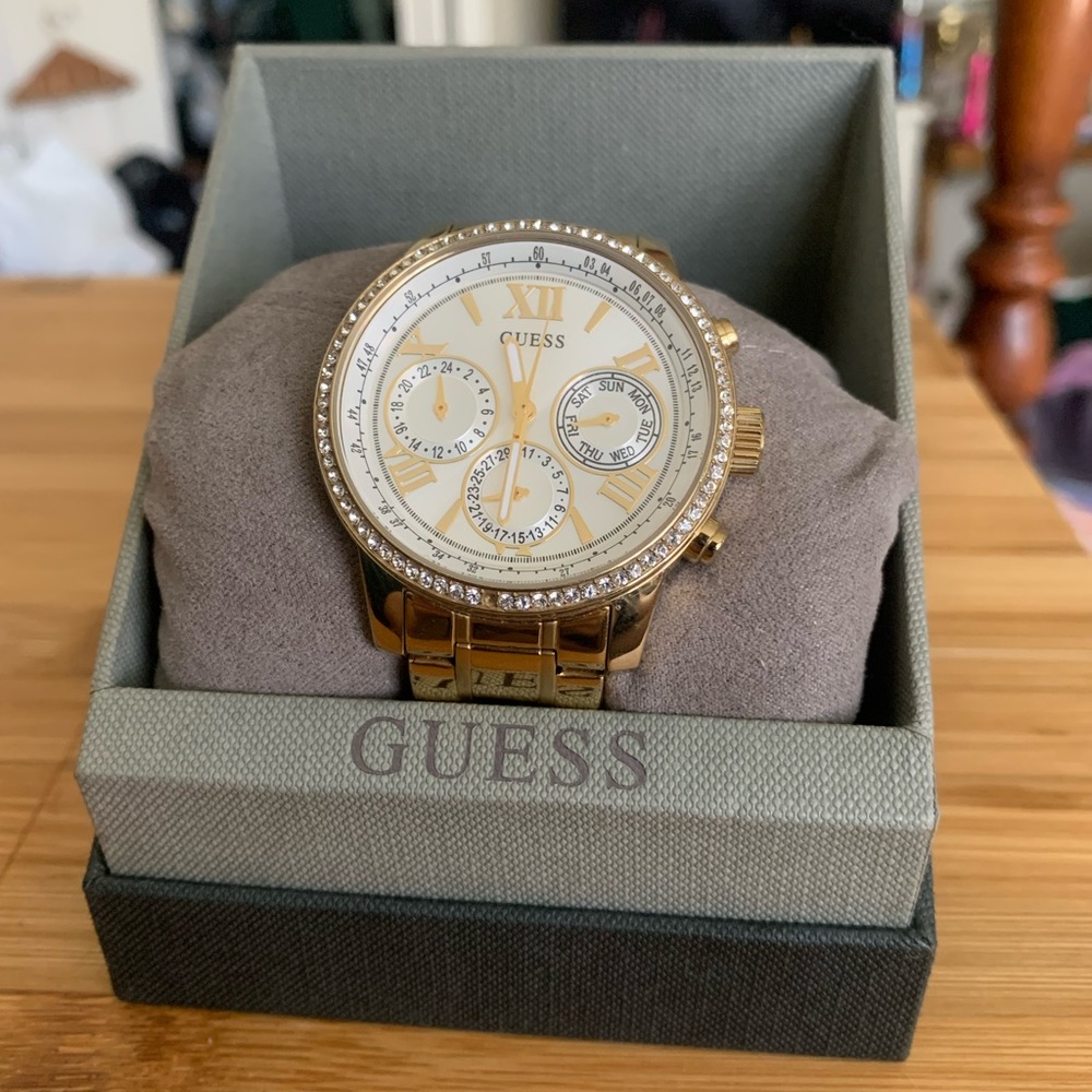 GUESS Women’s Large Face Gold Rhinestone Diamond Besel Luxury Watch